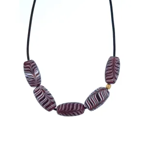 A Purple   White Swirled Glass Bead Necklace